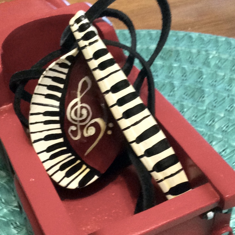 Classic hand made music symbols spoon necklace.